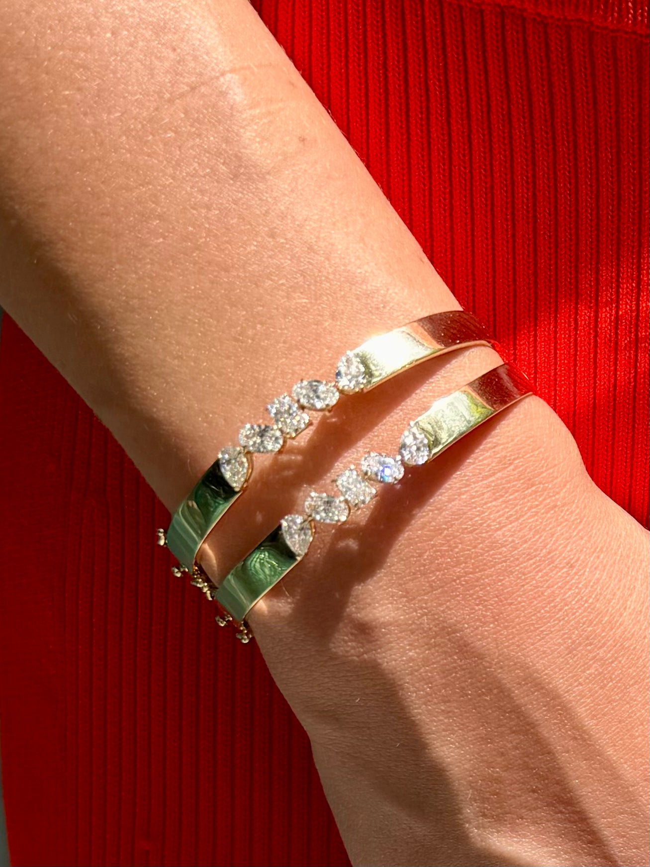 Mimi Bangle in 14k yellow gold with pear,oval,and radiant-cut diamonds styled on wrist— Waltz Diamonds
