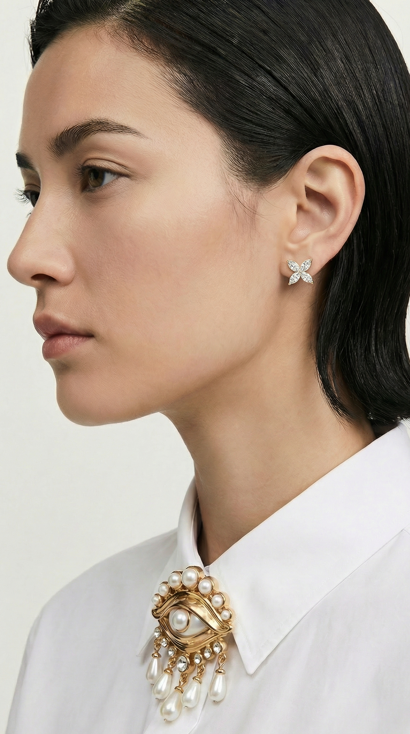 Night Blooming Jasmine studs featuring four marquis diamonds in flower shape on model Waltz Diamonds