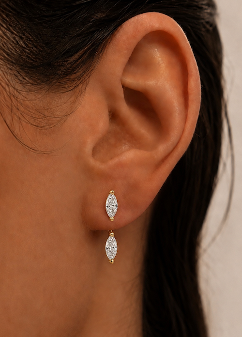 Orbit diamond earring jackets in marquise cut and yellow gold shown on models ear —  Waltz Diamonds