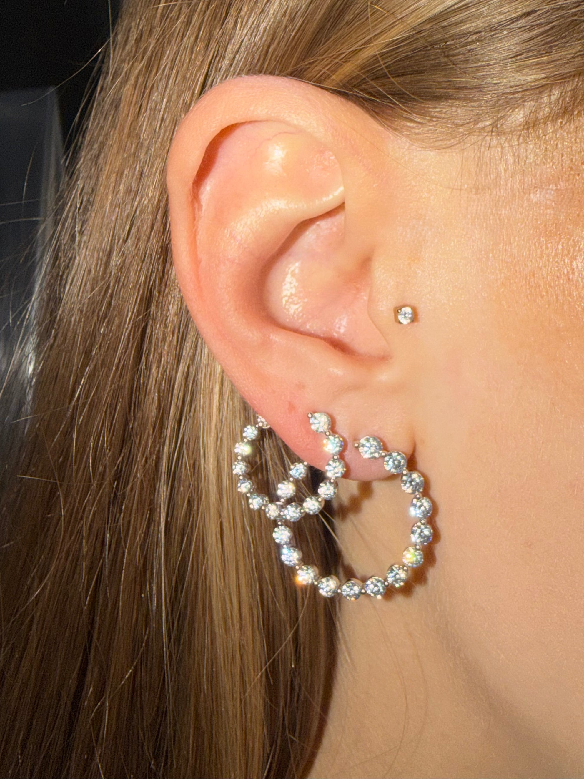 Outie Diamond Hoops front facing diamond hoops in white gold both sizes shown on ear — Waltz Diamonds