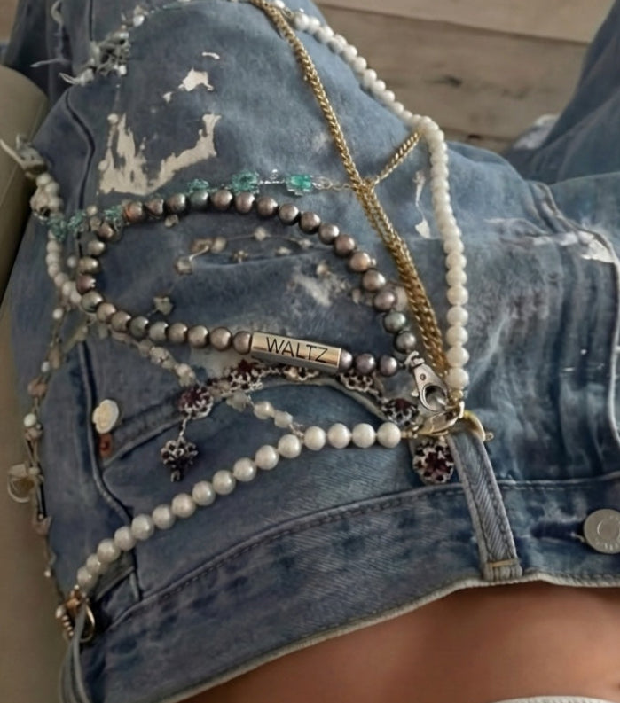 Pearl Companion in peacock color styled on a womans jeans—Waltz Diamonds