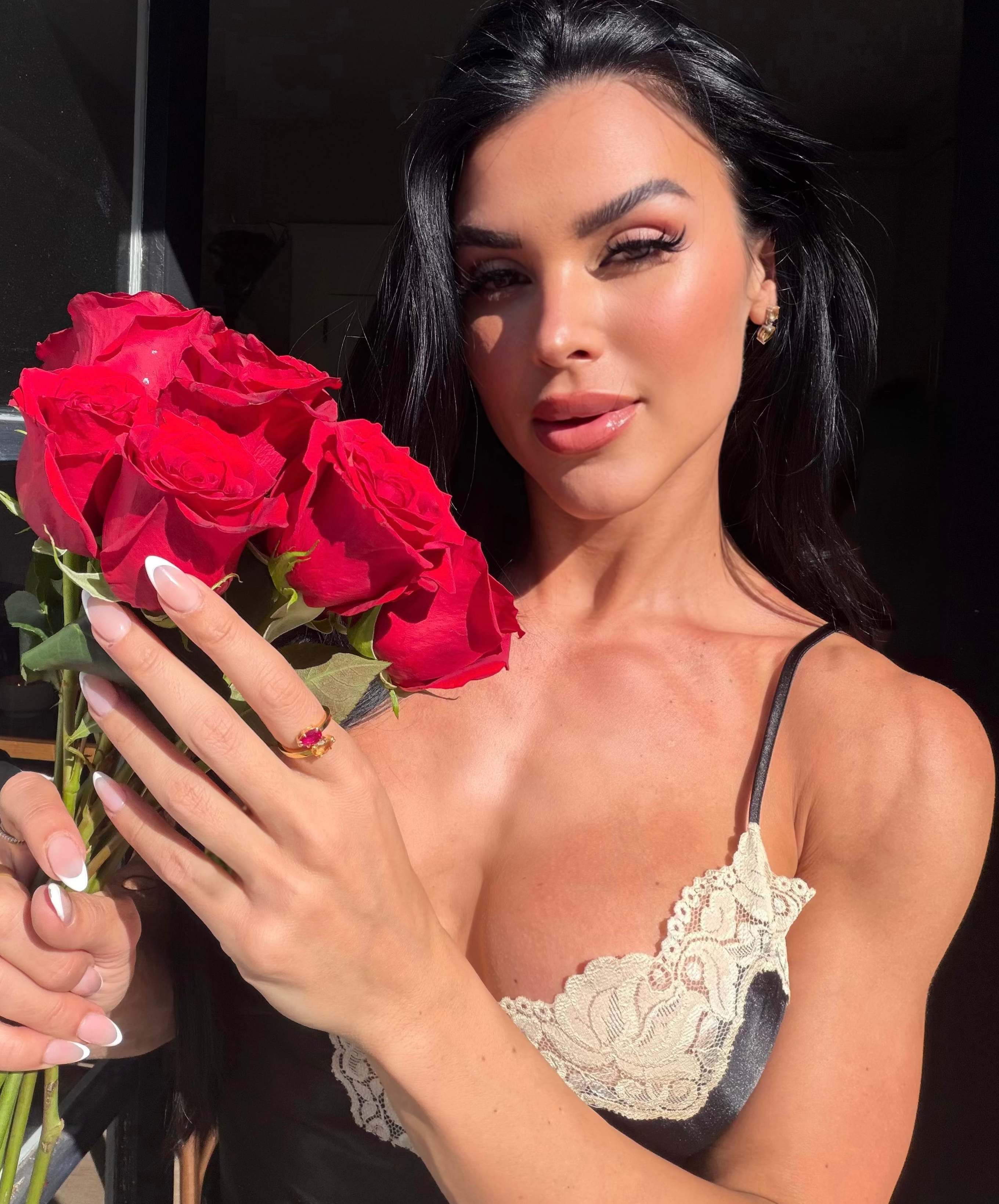 The perfect pear birthstone ring on model featured with ruby and citrine in yellow gold