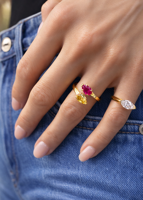 The perfect pear birthstone ring featuring a ruby and citrine in yellow gold on model —Waltz Diamonds