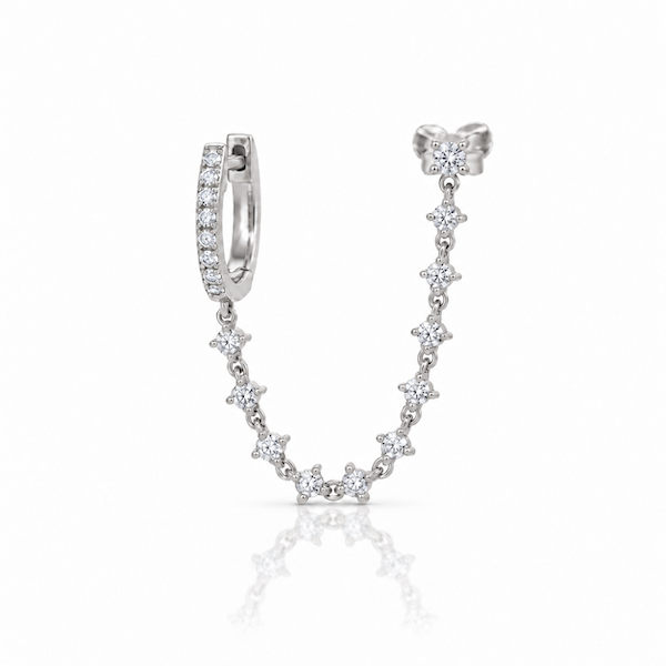 Plus one diamond chain huggie is designed for two piericngs and connects a diamond huggie with a chain of diamonds to another in yellow gold — Waltz Diamonds