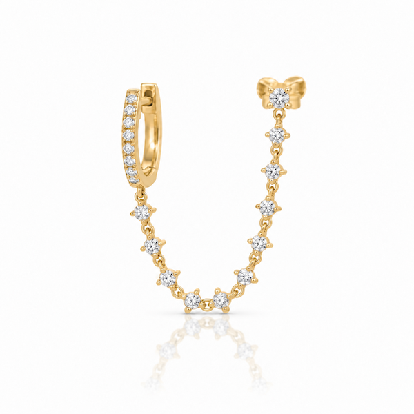 Plus one diamond chain huggie is designed for two piericngs and connects a diamond huggie with a chain of diamonds to another in yellow gold — Waltz Diamonds