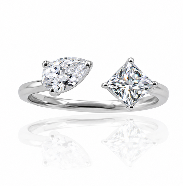 Princess pear ring featuring a pear cut and a princess cut diamond in an open asymmetrical setting white gold — Waltz Diamonds
