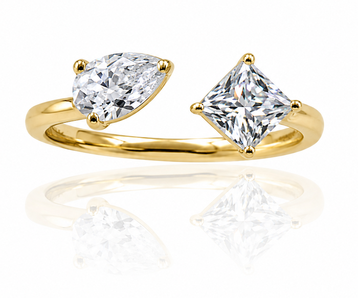Princess pear ring featuring a pear cut and a princess cut diamond in an open asymmetrical setting yellow gold — Waltz Diamonds