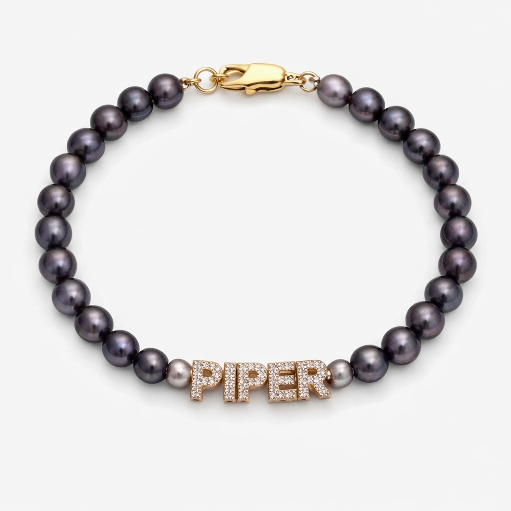 Prosperity pearl bracelet in peacock color with pave diamonds spelling piper