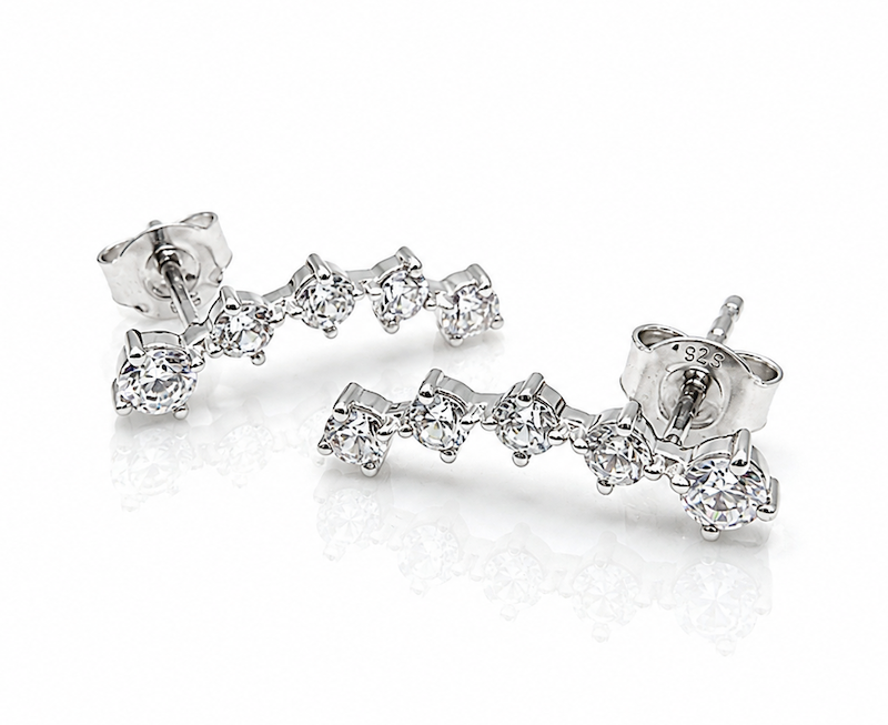 Round social climbers with five diamonds that curve perfectly up the ears in white gold laying flat — Waltz Diamonds