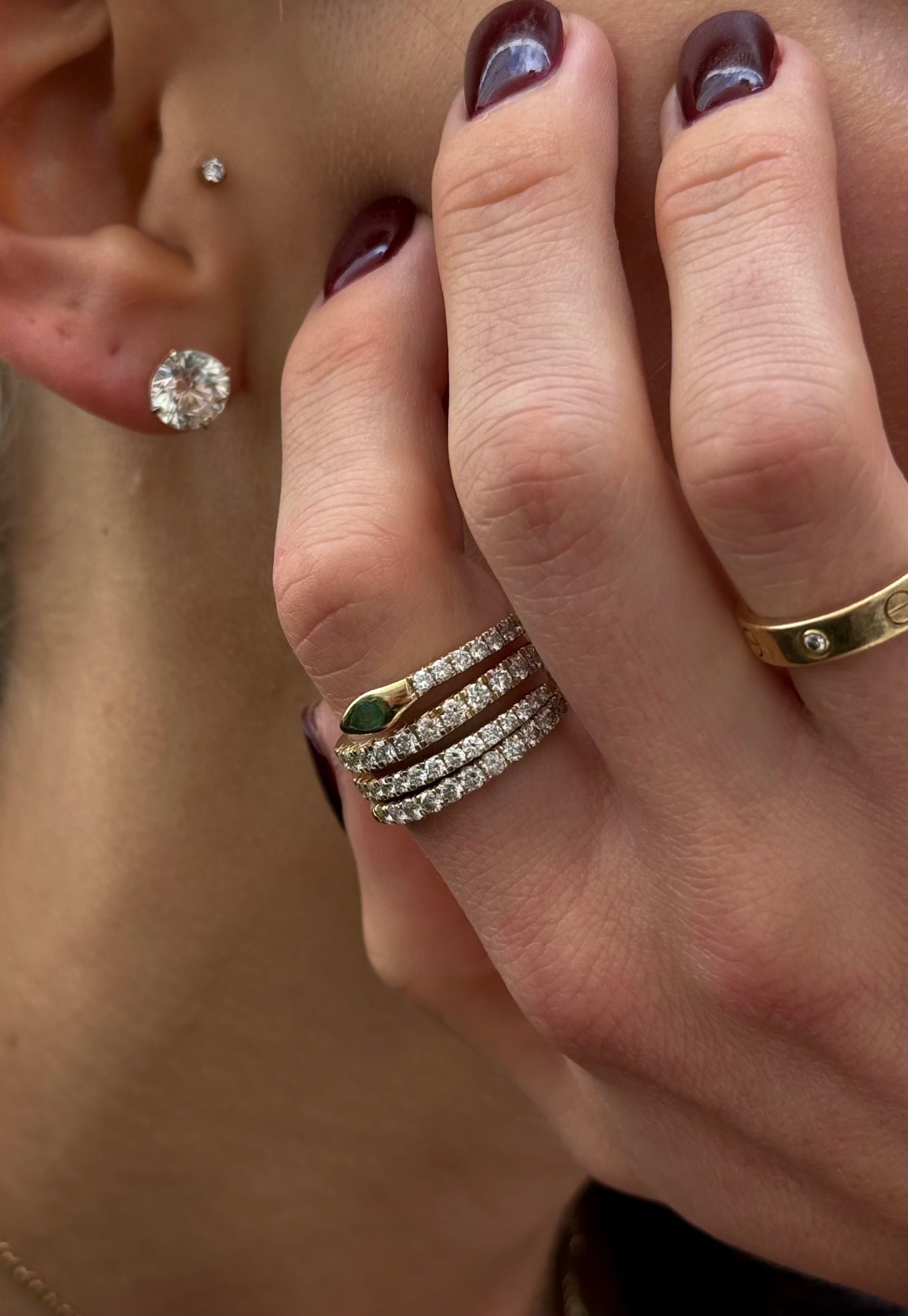 Satnam snake ring in yellow gold on model — Waltz Diamonds