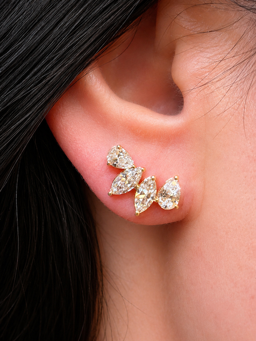 Side Piece climber stud featuring two pear cut and two marquise cut diamonds to climb up the ear styled on model in yellow gold— Waltz Diamonds