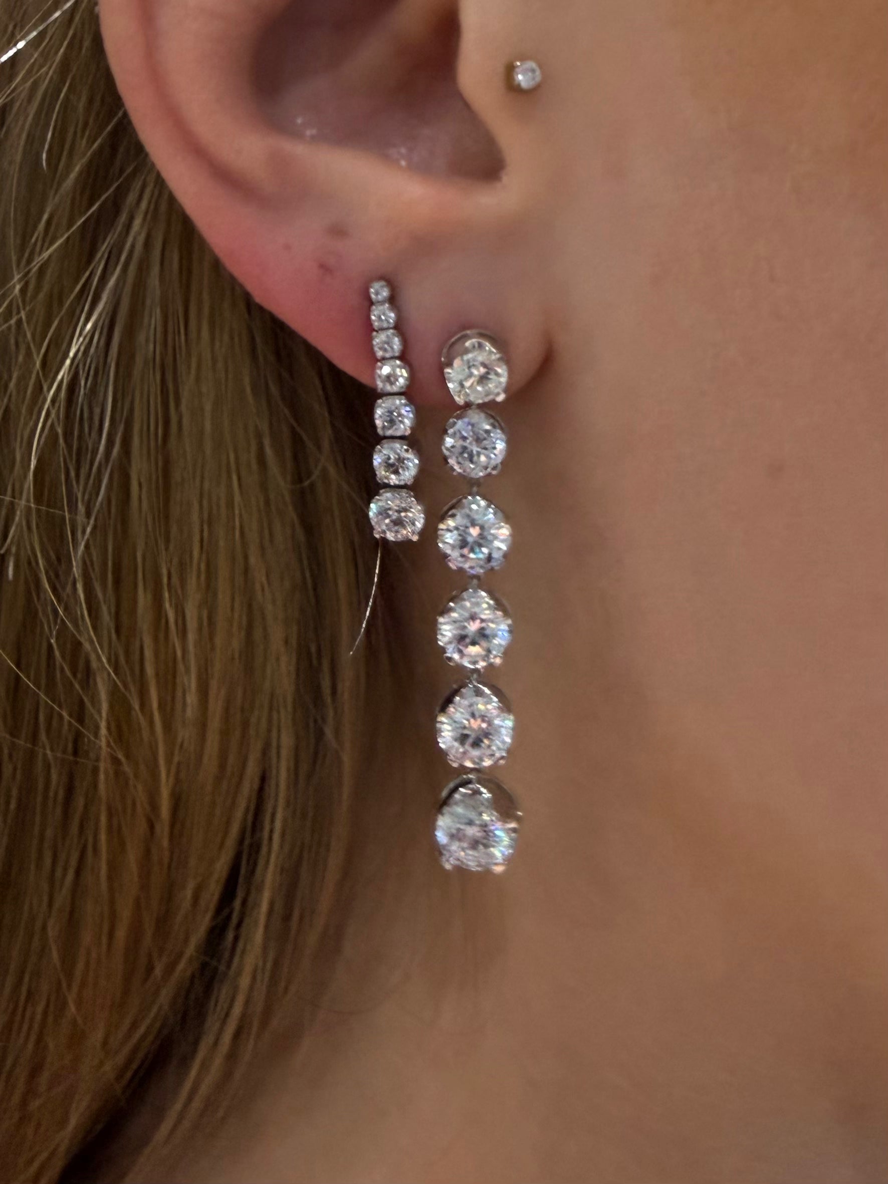 Six Drop Diamond Earrings 6ctw in white gold paired with other diamond earrings from Waltz — Waltz Diamonds