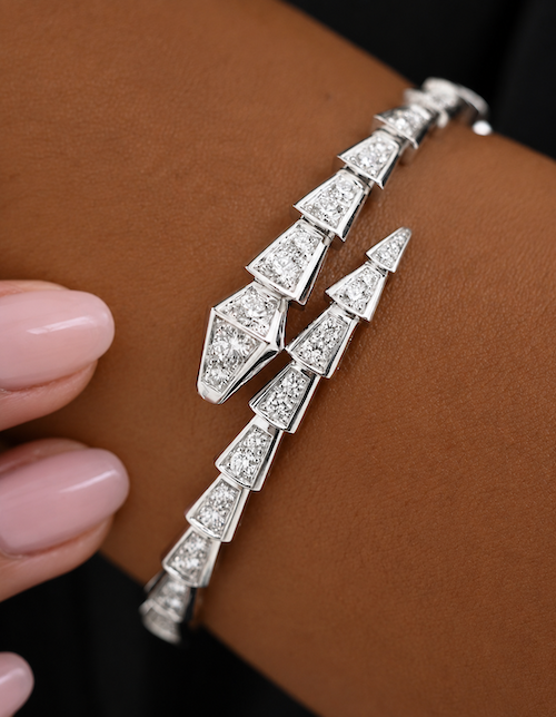 Slither Diamond Wrap bangle in 14k white gold with diamond-set snake design styled on the wrist close up — Waltz Diamonds