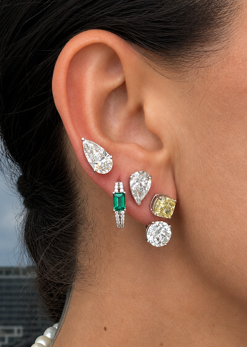 Sugar baby hoops green emerald and white gold styled on ear — Waltz Diamonds