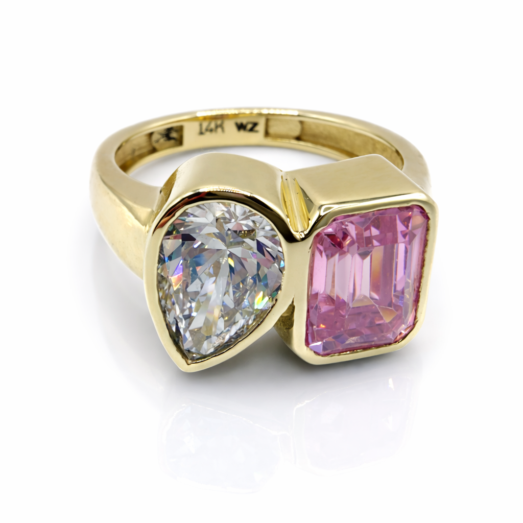 Take Two Toi et Moi Ring with a pink sapphire and pear cut diamond in yellow gold  — Waltz Diamonds
