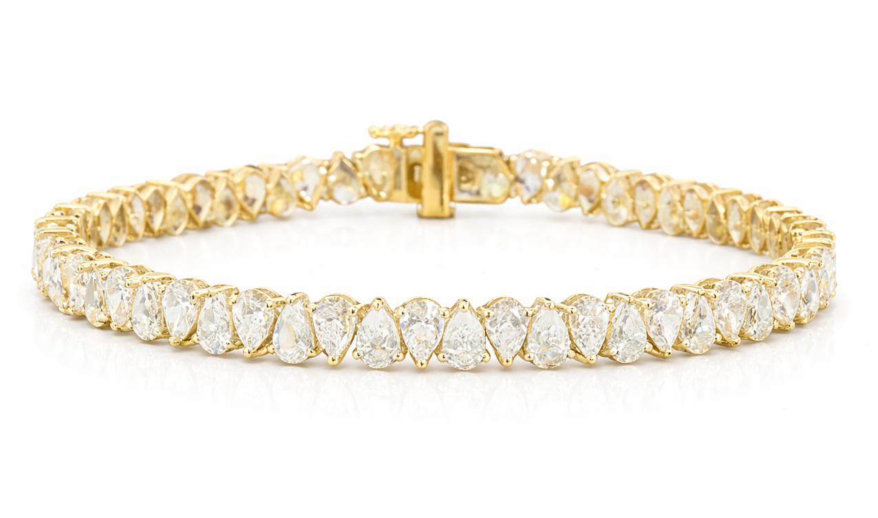 Tears of Joy rotating pear cut diamond tennis bracelet in yellow gold — Waltz Diamonds