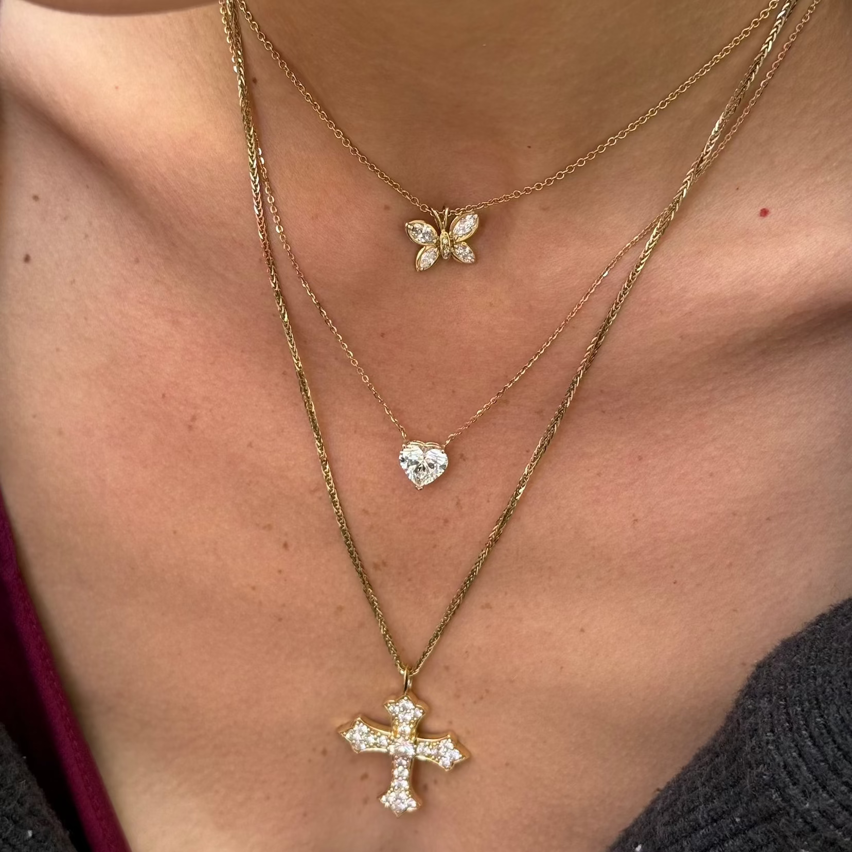 The chosen diamond heart necklace in yellow gold stacked on model—Waltz Diamonds