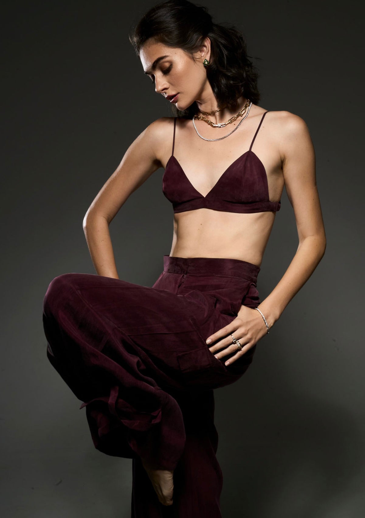 Editorial image of model wearing the All Day Everyday Bangle with coordinating rings and layered necklaces.