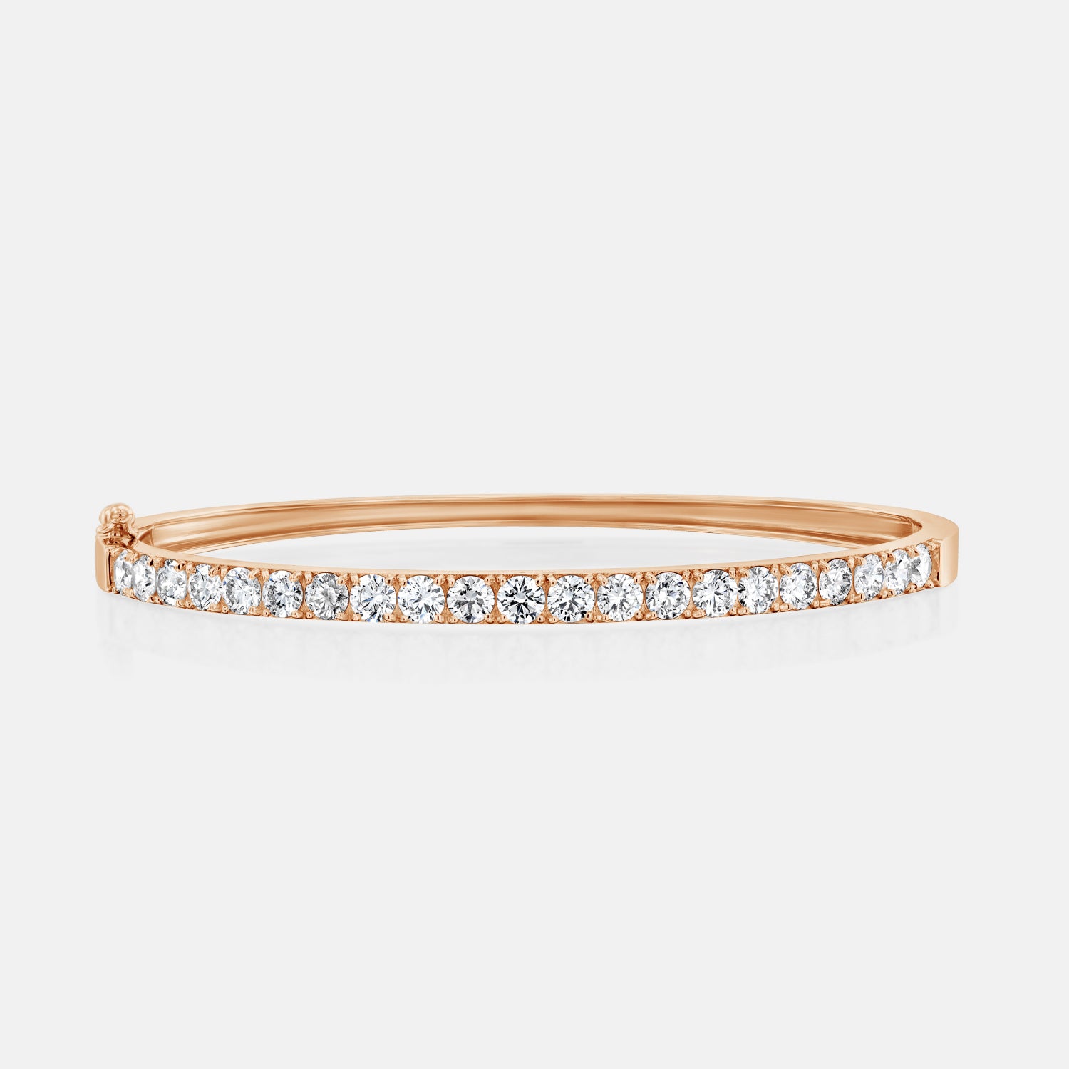 Rose gold version of the All Day Everyday Bangle in a horizontal position, showcasing the inside band.