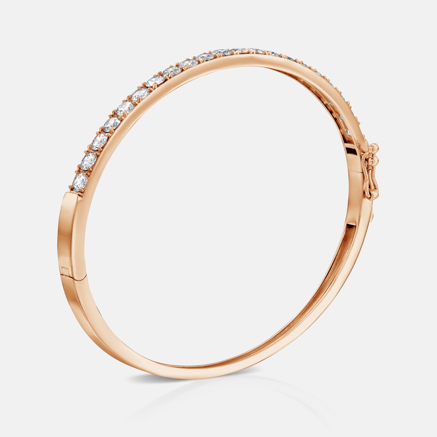 Rose gold All Day Everyday Bangle standing up, featuring detail of the hidden clasp and clean, modern lines.