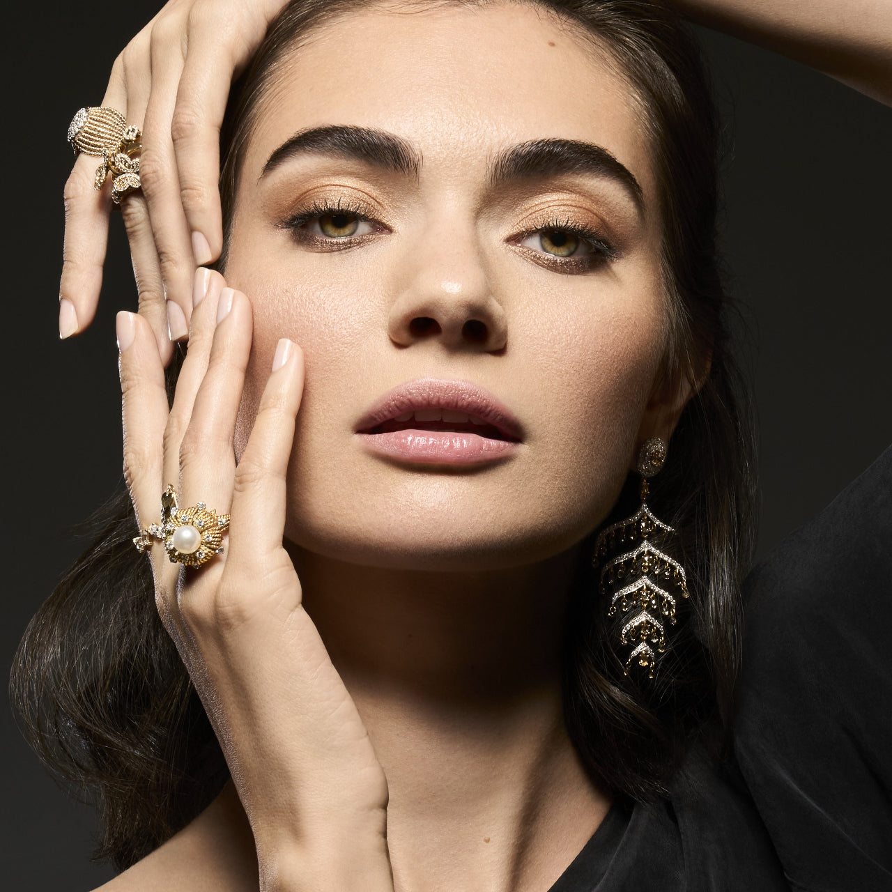 Editorial shot of antique pearl and diamond ring worn by model