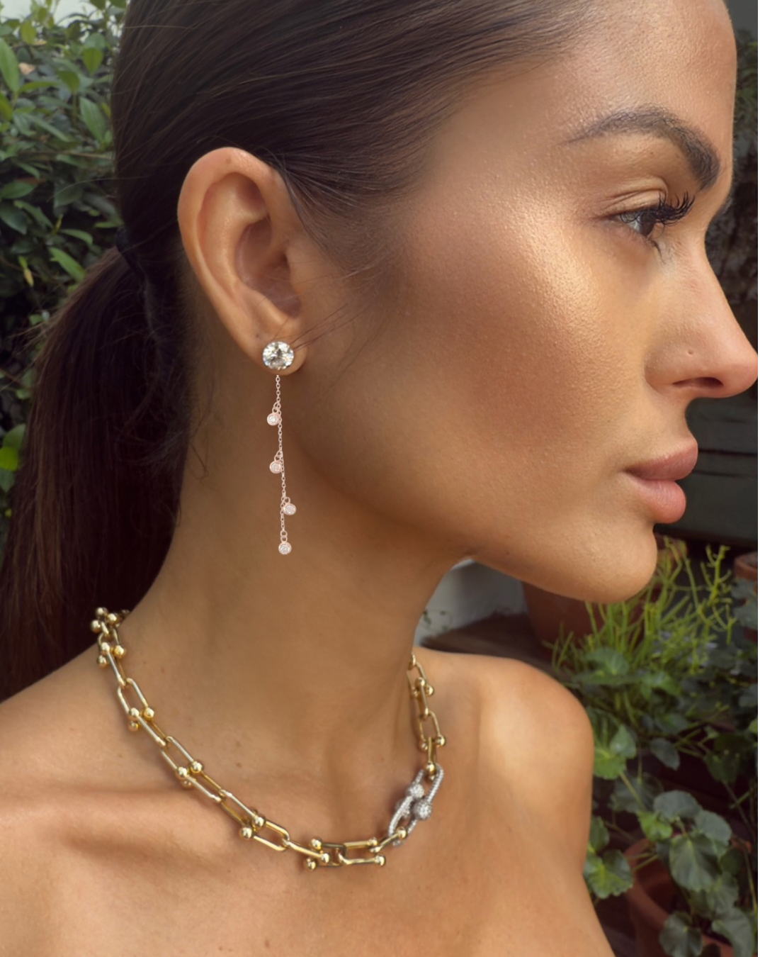 Model wearing Cherry Ear Jackets in rose gold, showing how the earring jackets enhance a simple stud look