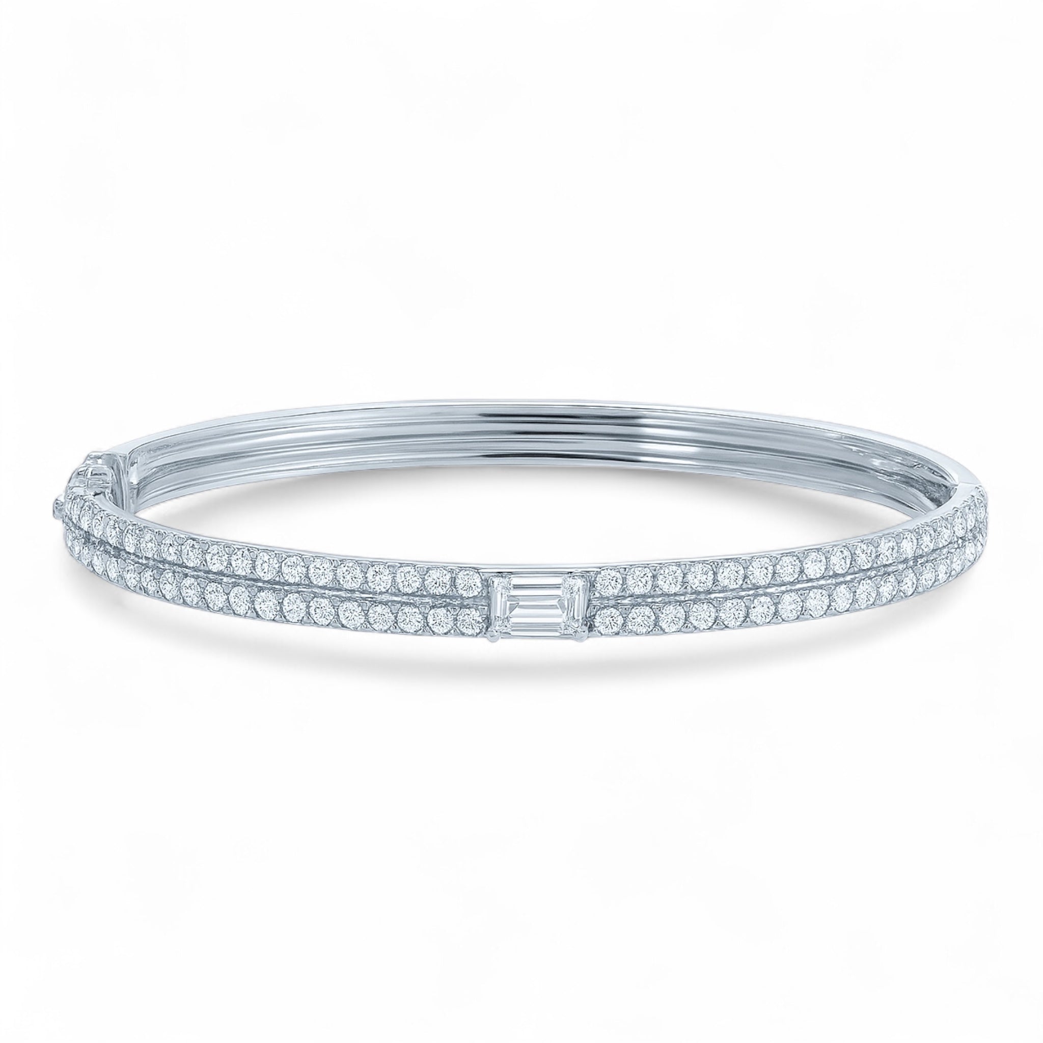 The Clarity Bangle in white gold featuring emerald-cut center diamond and pavé details, front view with inner design visible