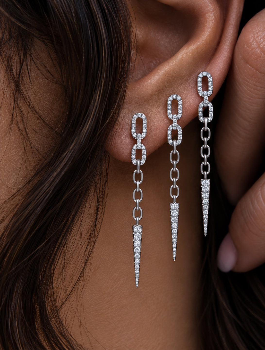 Dagger Drop Earrings with diamond pave links, chain detail and pointed diamond drops in white gold on model — Waltz Diamonds