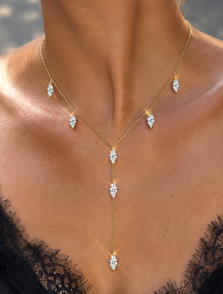 Dancing marquise lariat featuring seven drop marquise diamonds along a fine yellow gold chain in a y shape on model — Waltz Diamonds