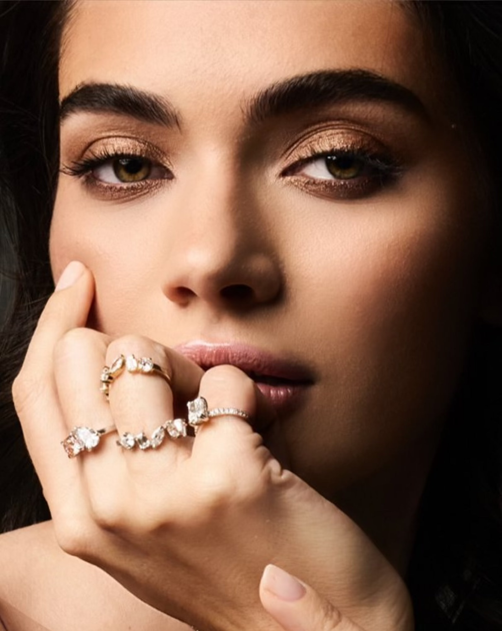 Editorial image of a model hand styled with stacked diamond rings including the Diversity Band — Waltz Diamonds