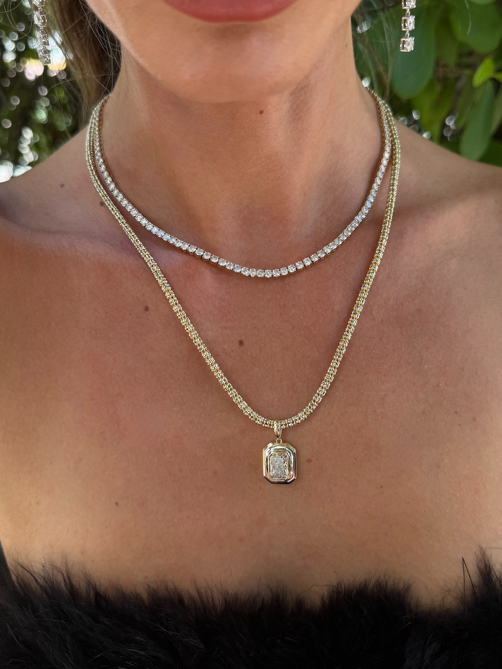Double framed diamond pendant 3 carat cushion cut diamond set in a two toned framed pendant on woman — Waltz Diamonds
