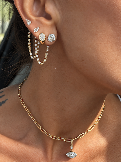 Eclipse Baby Diamond Huggies 1 ctw oval domed huggies yellow gold on ear styled with several other Waltz pieces— Waltz Diamonds