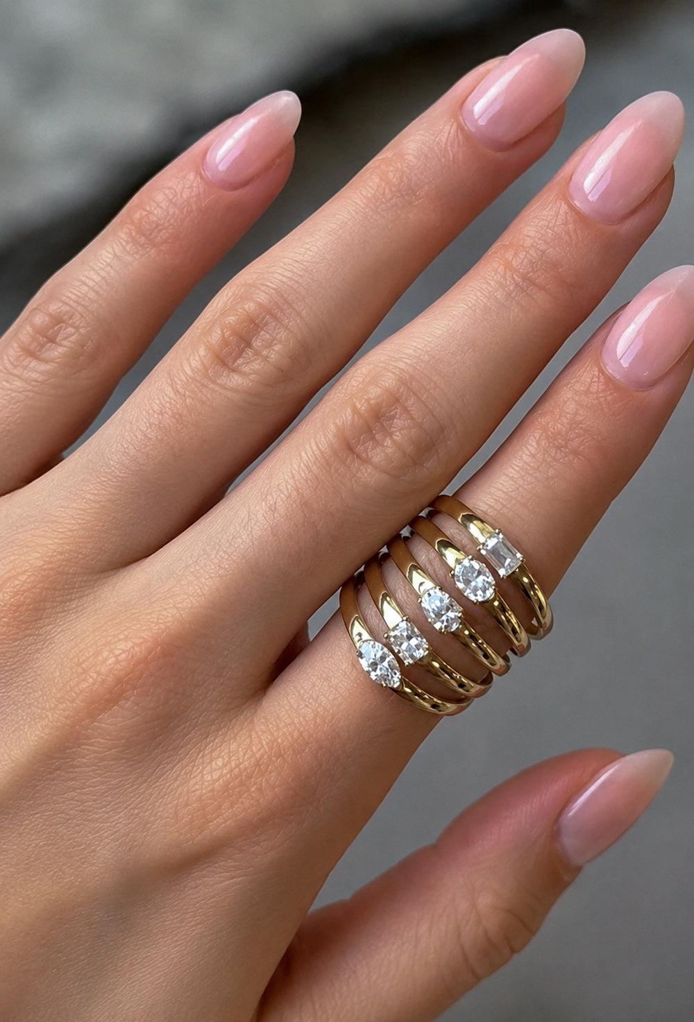 High five ring with five bands with different cut diamonds in yellow gold on hand —Waltz Diamonds