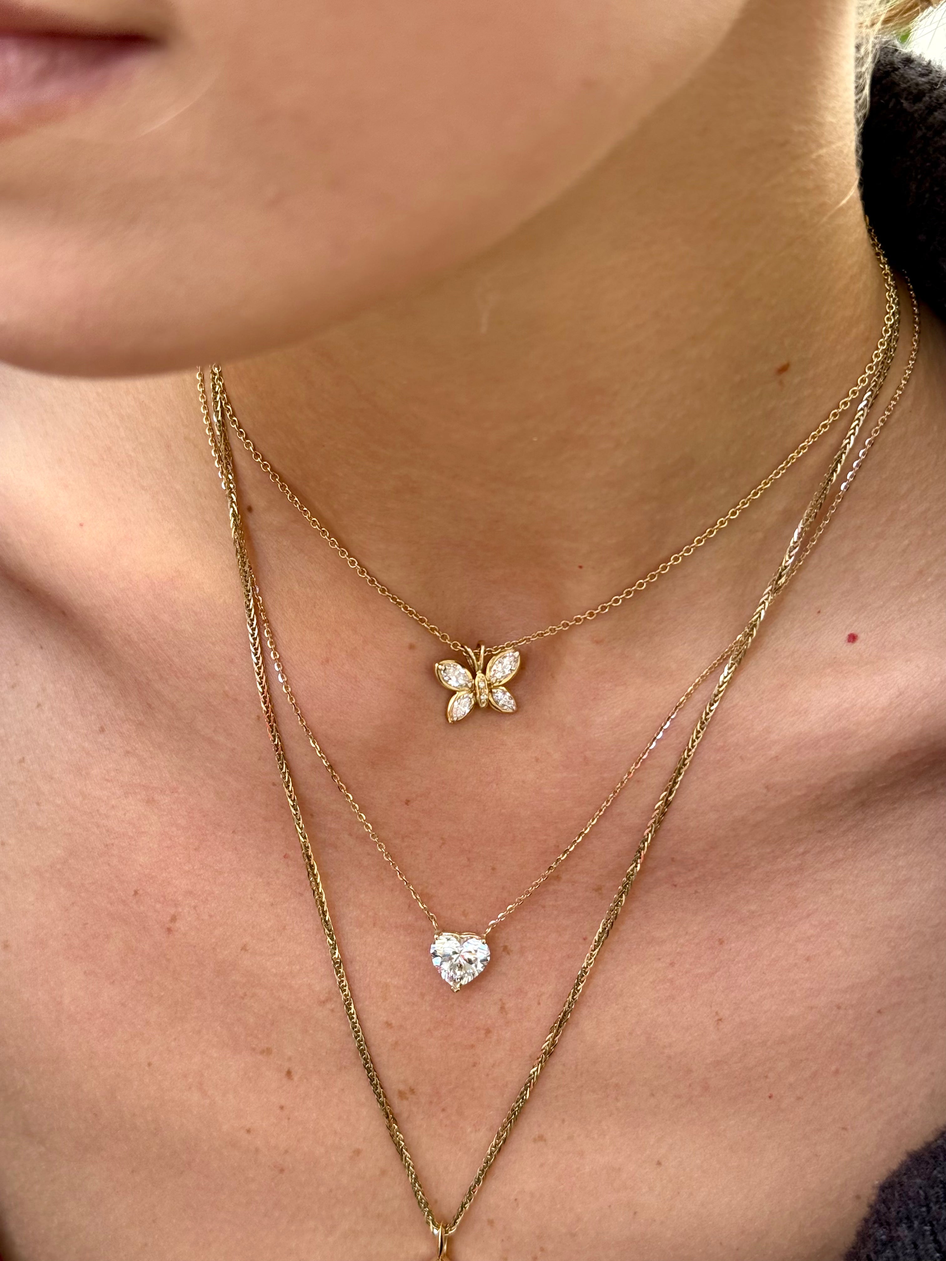 Jasmines Butterfly pendant in yellow gold worn on model—Waltz Diamonds