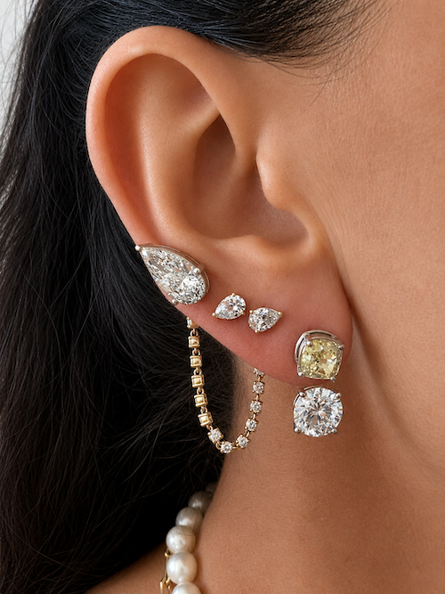 Lemon Drop Earring  jacket yellow diamond and a white diamond jacket white gold styled on ear with multiple earrings — Waltz Diamonds
