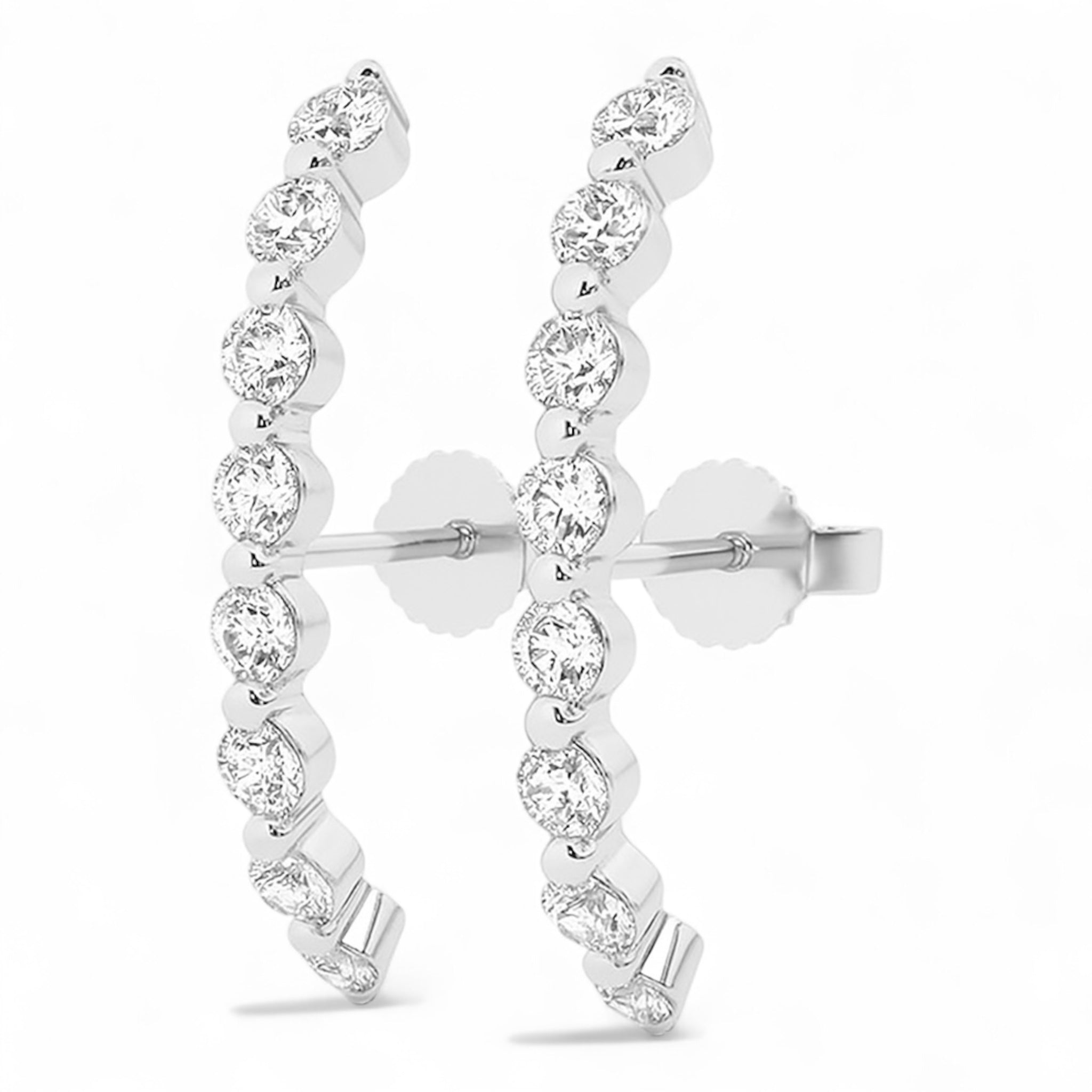 Side view of Luna Light curved diamond earrings in white gold inspired by moonlight