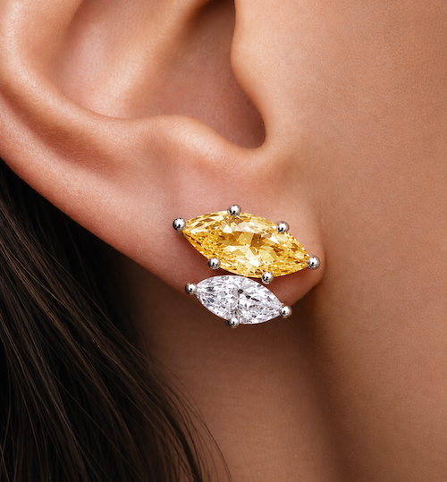 Marquise sidekick double diamond studs in white gold one yellow diamond one white worn on ear — Waltz Diamonds
