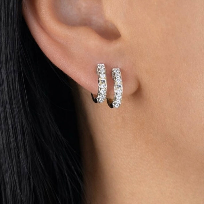 Mini snugglers three sided pave huggies in white gold on model — Waltz Diamonds