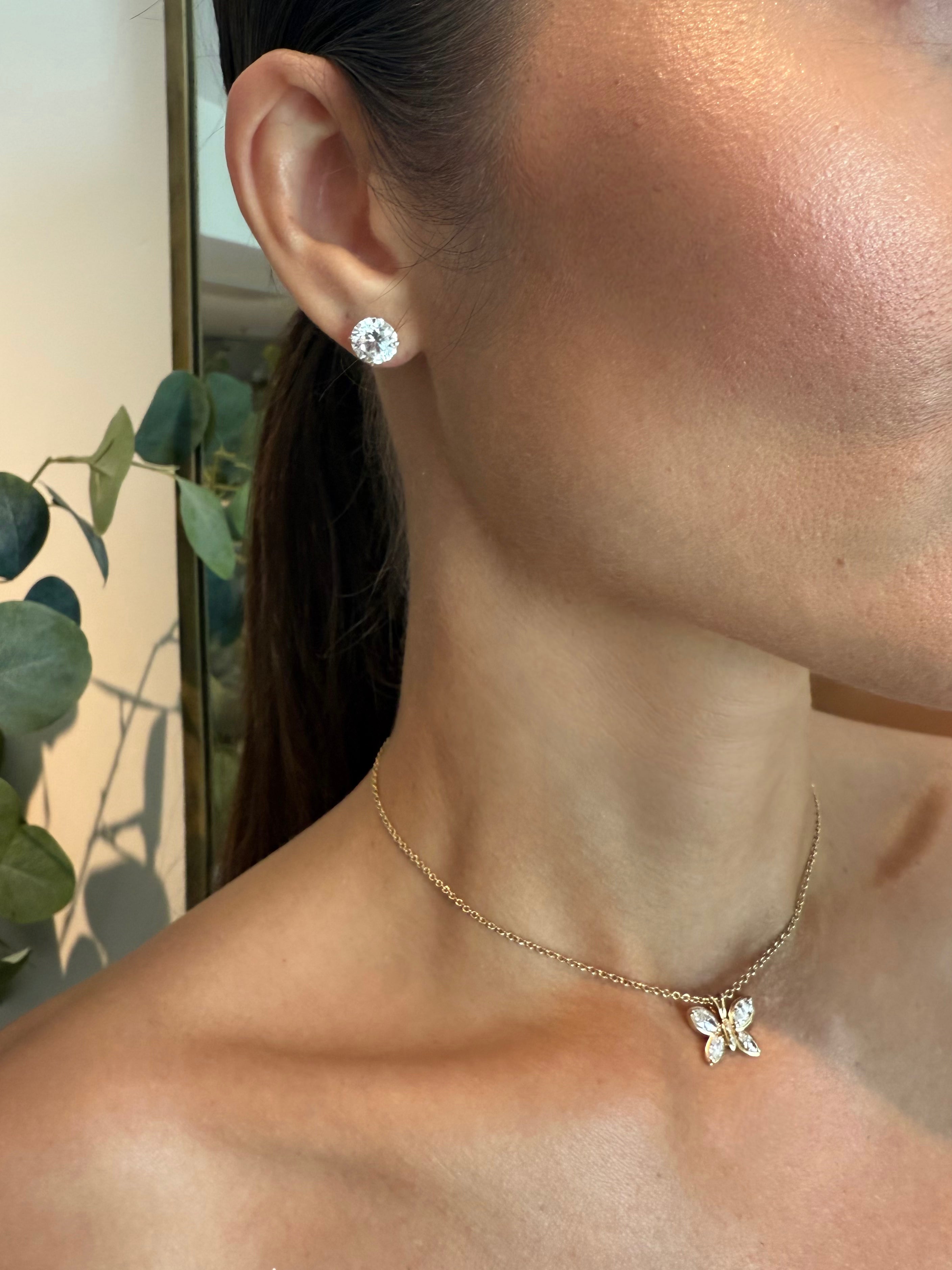 Model wearing My Forever round brilliant diamond studs and Jasmine's Butterfly Pendant for timeless everyday elegance