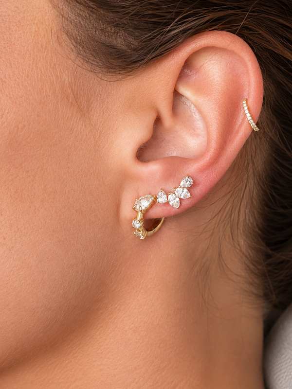 Side Piece climber stud featuring two pear cut and two marquise cut diamonds to climb up the ear styled on model in yellow gold— Waltz Diamonds