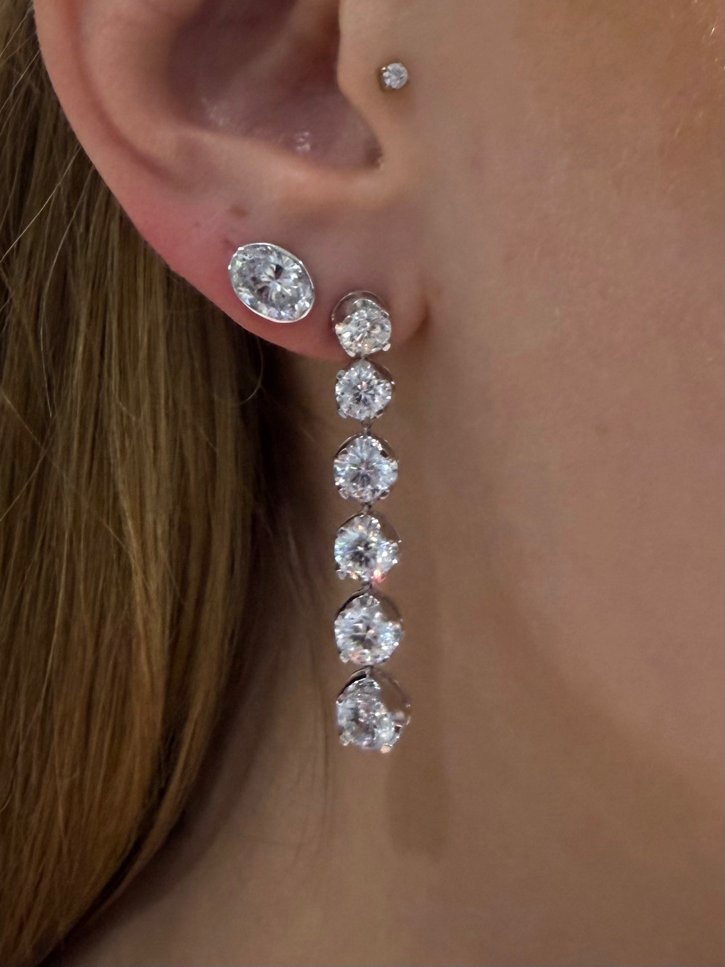 Six Drop Diamond Earrings 6ctw in white gold paired with other diamond earrings from Waltz — Waltz Diamonds