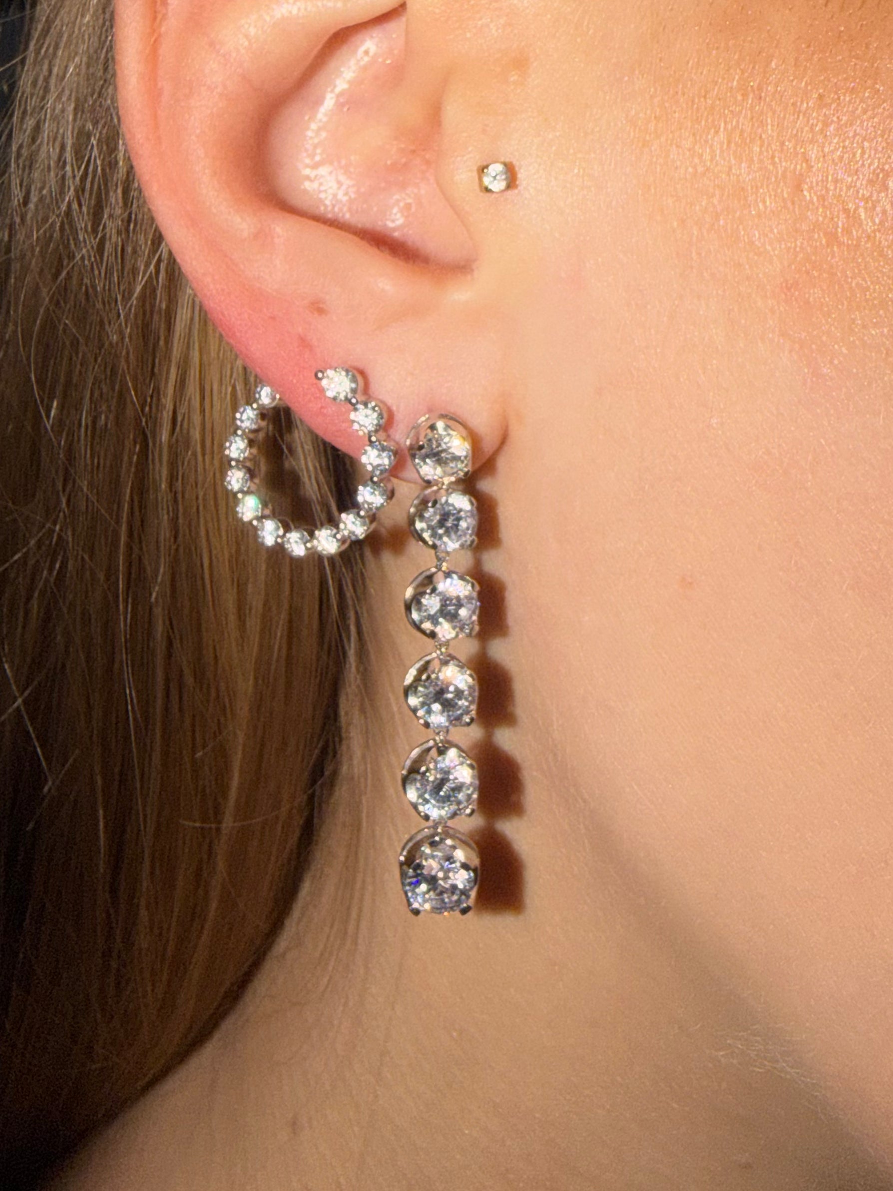Six Drop Diamond Earrings 6ctw in white gold paired with other diamond earrings from Waltz — Waltz Diamonds