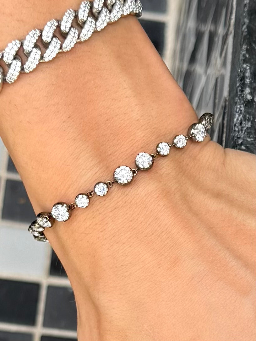 Sovereign Diamond Link Bracelet with round diamonds in varying sizes, rustic black rhodium settings, black rhodium links on wrist  – Waltz Diamonds