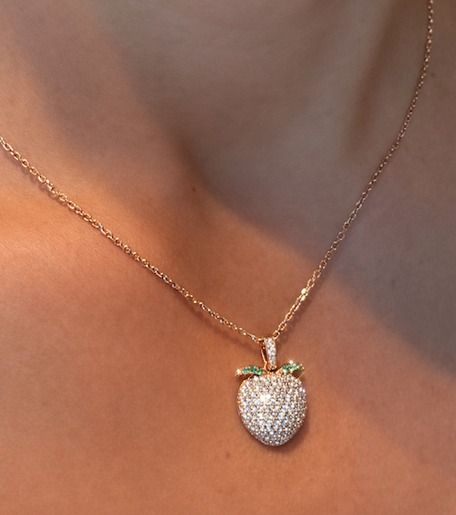 Sweet Peach-pendant in pave diamonds and green leaves in rose gold on models neck — Waltz Diamonds