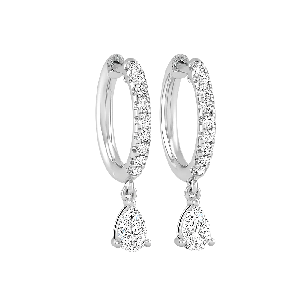 Close-up of white gold Unhinged Huggies hoop earring with pear-shaped drop and pavé diamonds