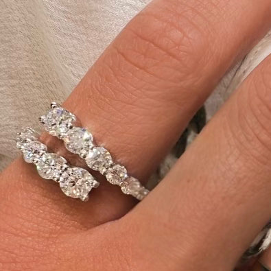 Wrap Party Ring in 14k white gold shown on hand, bypass wrap-style design